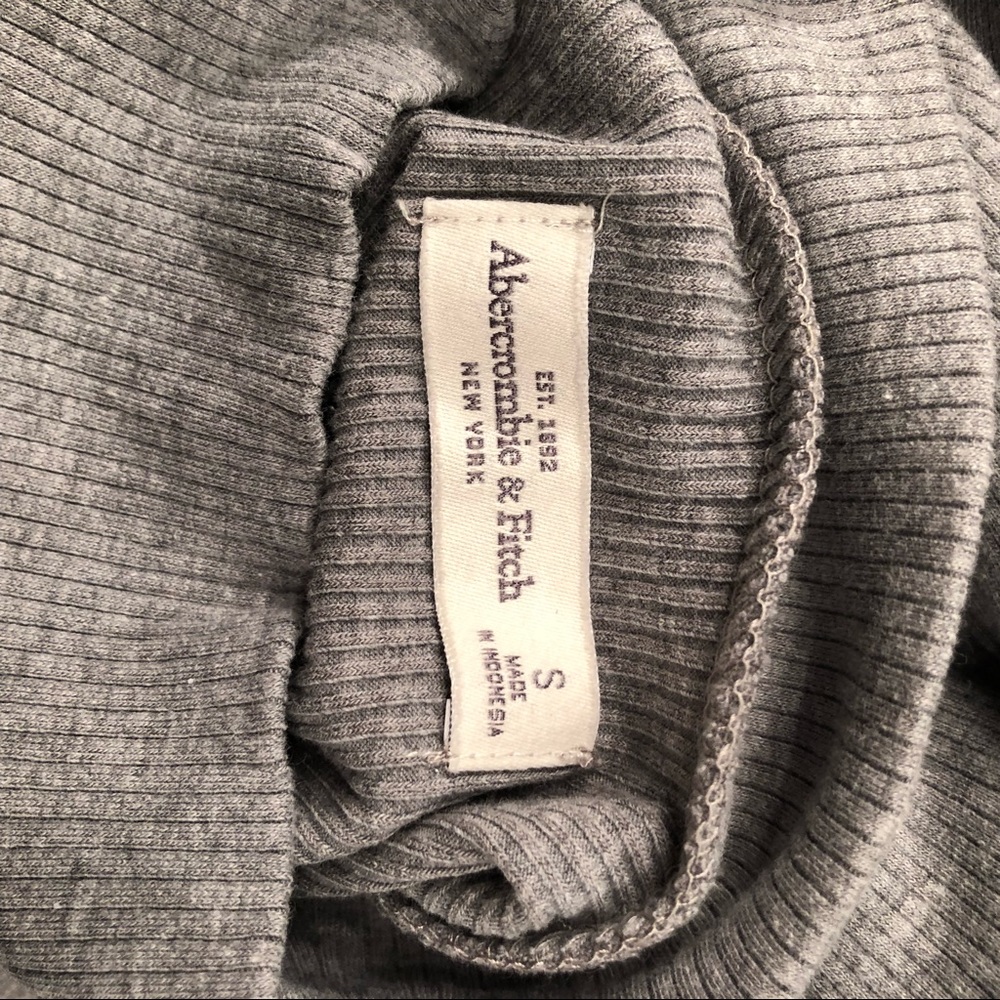 A gray mid turtle neck